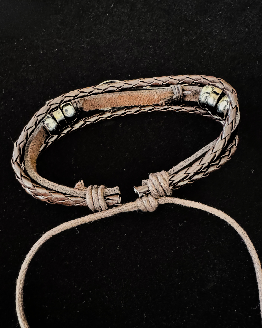 The Fallen Wing — Braided Leather Feather Bracelet