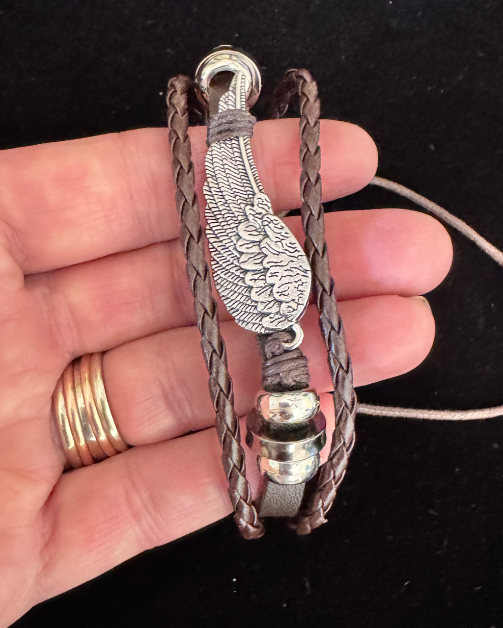 The Fallen Wing — Braided Leather Feather Bracelet
